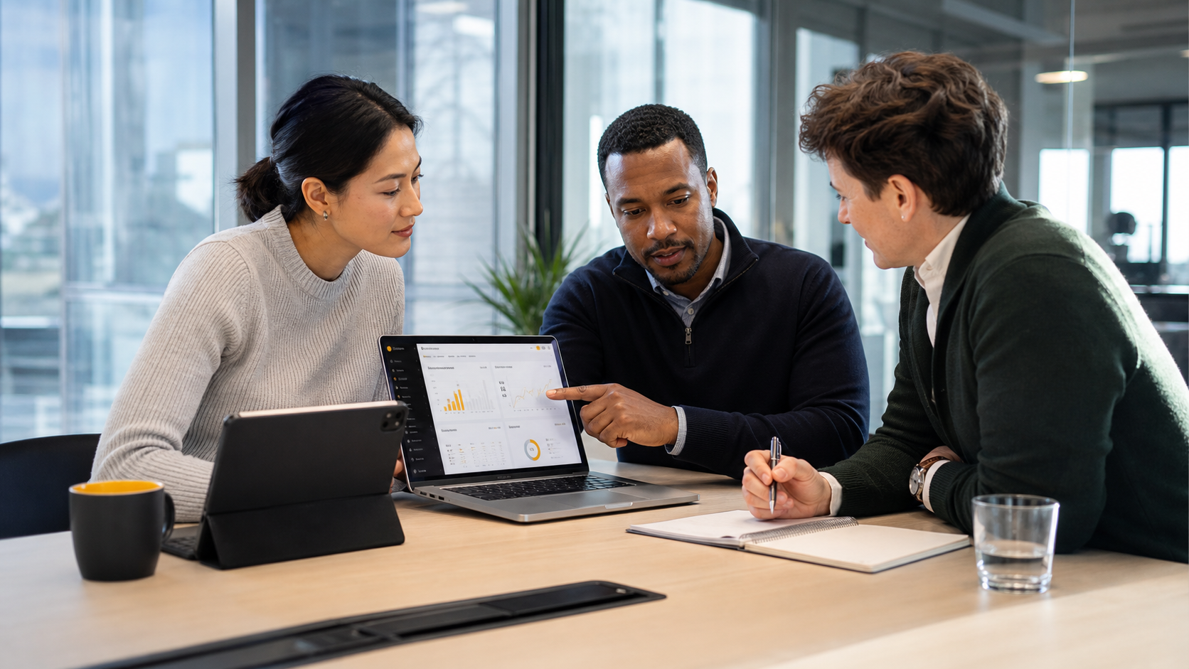 Finance Team Reviewing Reports at Modern Office Desk